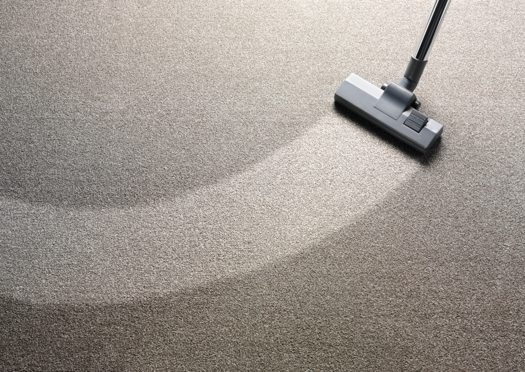 Vacuum cleaner on a carpet with an extra clean strip Jones Janitorial
